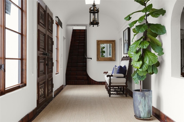 hallway with light colored carpet