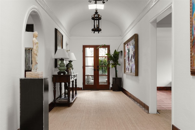 entryway with light carpet, lofted ceiling, and french doors