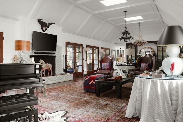 living room featuring a notable chandelier, dark hardwood / wood-style floors, french doors, and lofted ceiling with beams