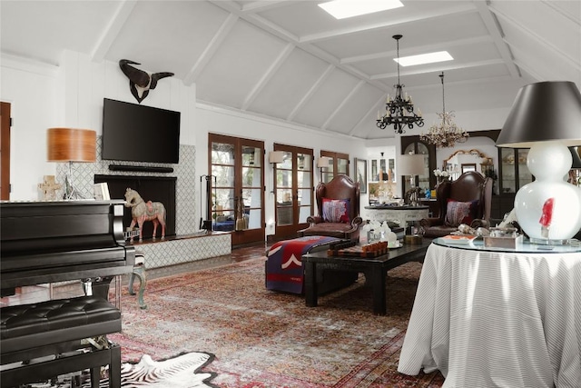 429 Sunfish St, Lakeway, TX 78734 - living area with a chandelier, a skylight, french doors, and high vaulted ceiling