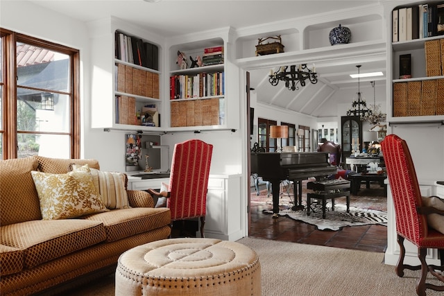 sitting room featuring dark tile flooring and a chandelier