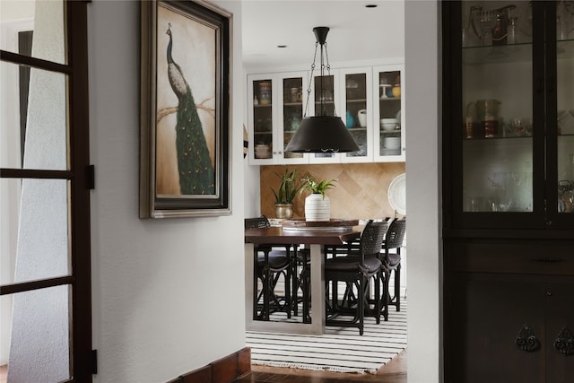 dining room with dark hardwood / wood-style flooring