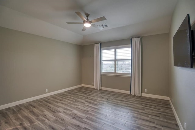 spare room featuring ceiling fan and hardwood / wood-style floors