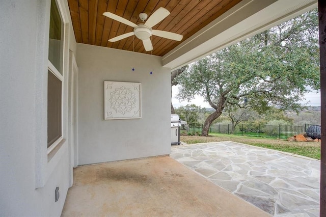 view of patio with a grill and ceiling fan