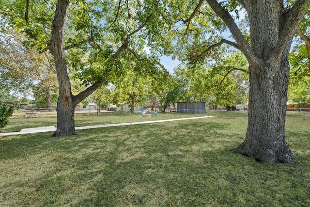 view of property's community with a yard