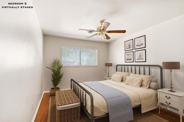 bedroom featuring ceiling fan and dark hardwood / wood-style flooring