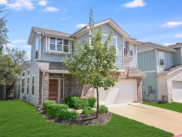 view of front of home featuring a front yard and a garage