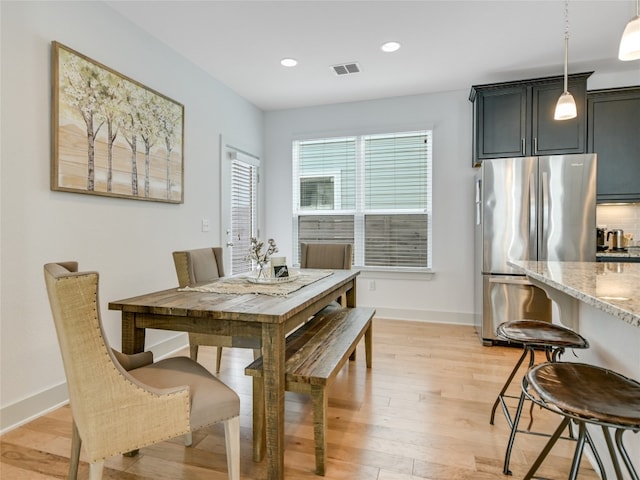 dining room featuring light wood-type flooring