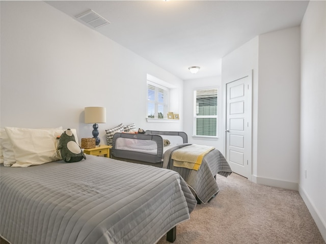 bedroom with light carpet