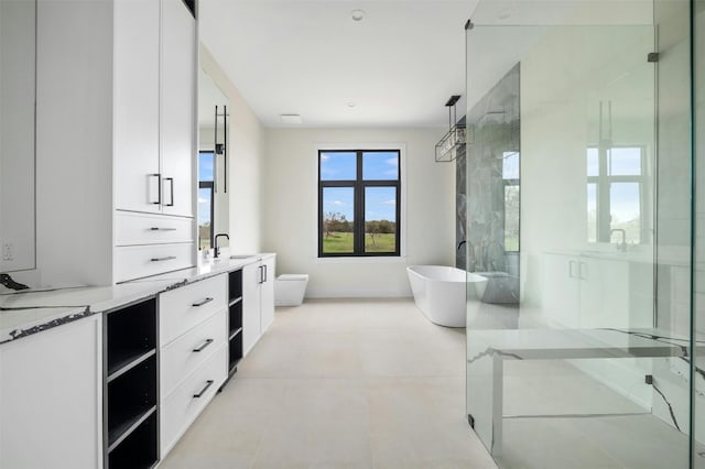 bathroom featuring tile floors, toilet, and vanity