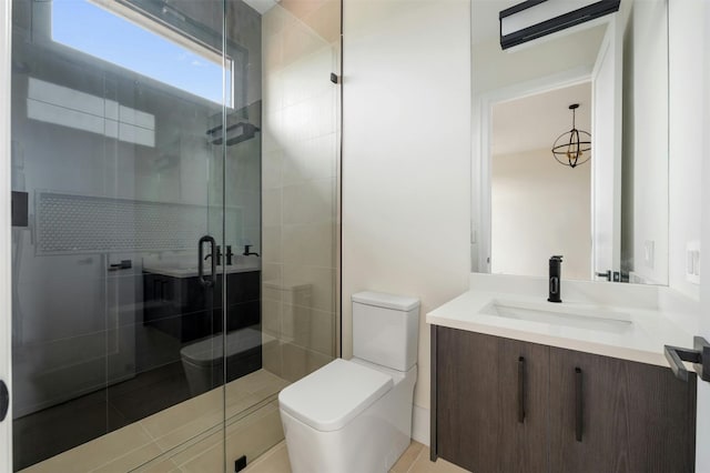 bathroom featuring an enclosed shower, toilet, and vanity