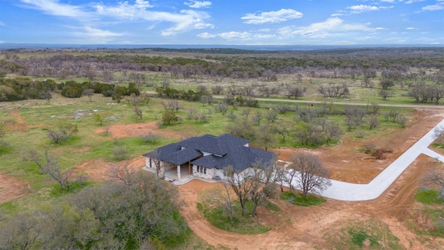 birds eye view of property featuring a rural view