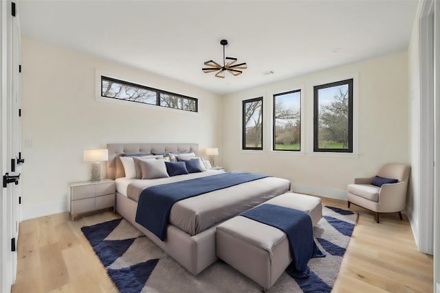 bedroom with light wood-type flooring