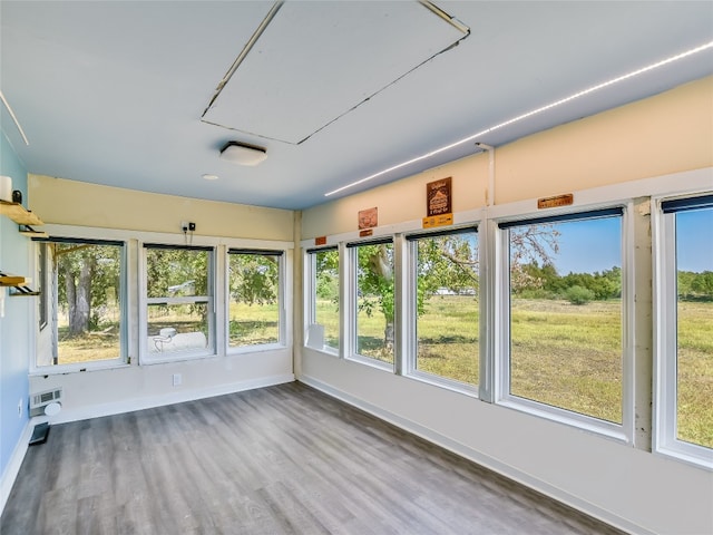 unfurnished sunroom featuring plenty of natural light