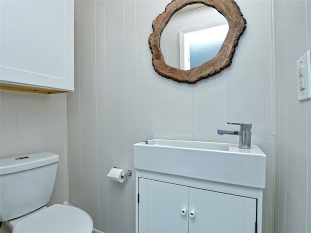 bathroom with toilet and vanity