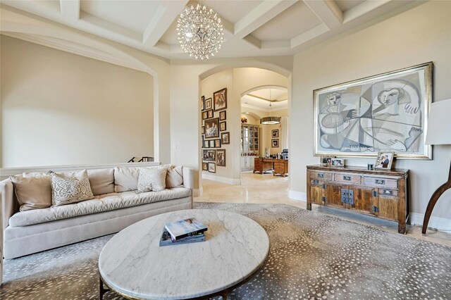 tiled living room featuring an inviting chandelier and coffered ceiling