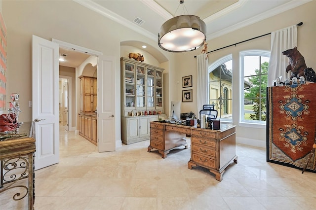 tiled home office featuring crown molding and a raised ceiling