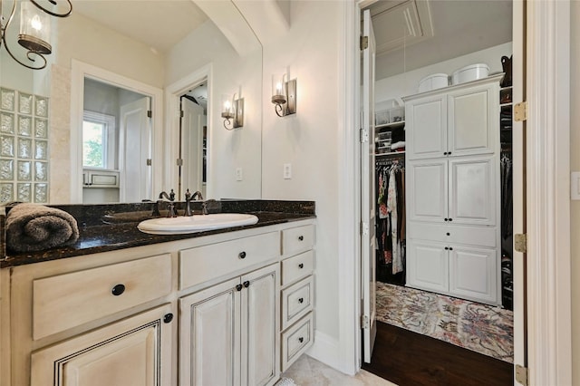 bathroom with vanity and wood-type flooring