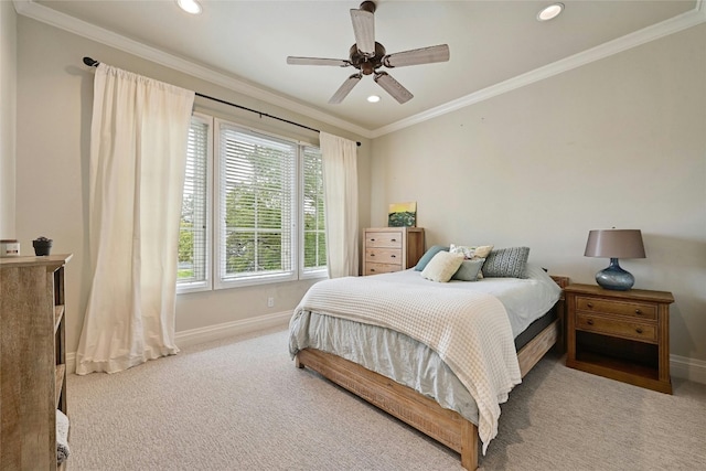 bedroom featuring ornamental molding, ceiling fan, and light colored carpet