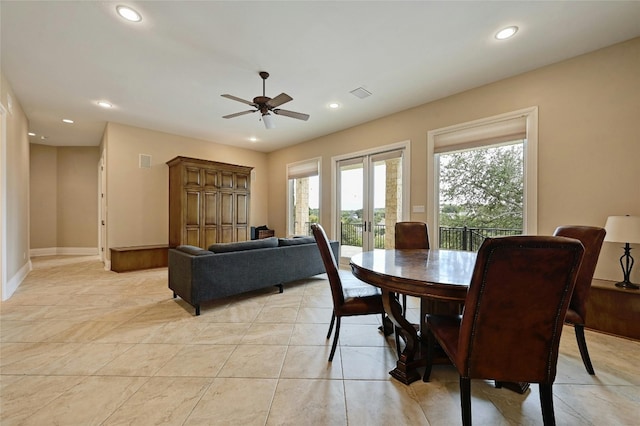 dining room featuring french doors, light tile floors, and ceiling fan