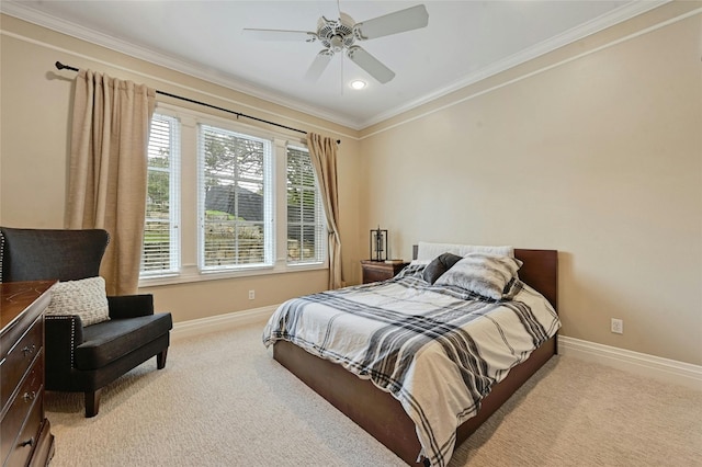 carpeted bedroom with ceiling fan and crown molding