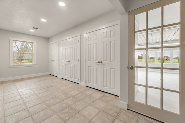 interior space with light tile floors