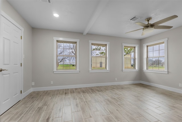 spare room featuring ceiling fan, light hardwood / wood-style flooring, and beam ceiling