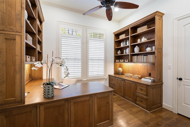 office with dark wood-type flooring, crown molding, and ceiling fan