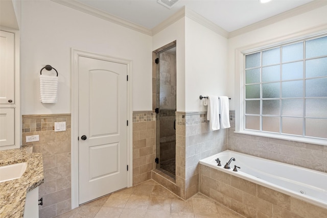 bathroom with separate shower and tub, vanity, tile walls, and crown molding