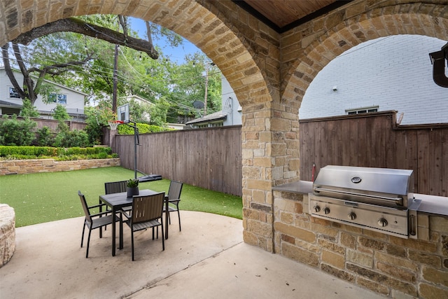 view of patio / terrace with a grill and an outdoor kitchen