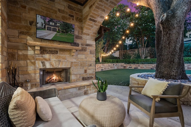 view of patio / terrace featuring an outdoor stone fireplace