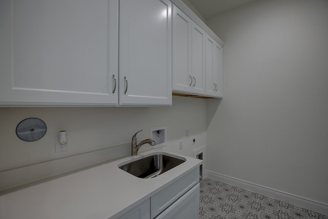 laundry room featuring sink, gas dryer hookup, cabinets, washer hookup, and hookup for an electric dryer