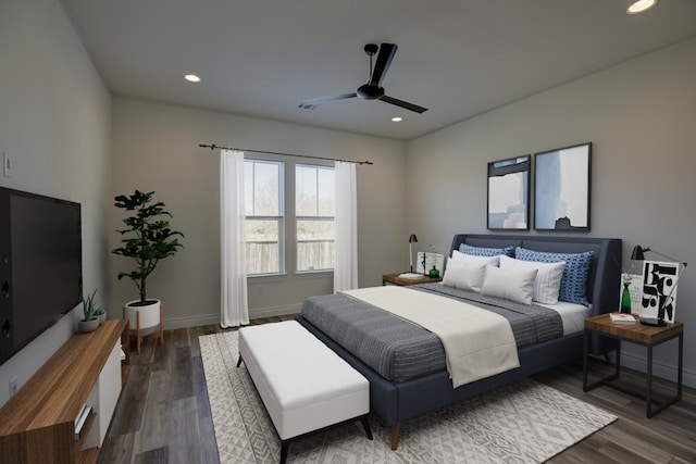 bedroom with hardwood / wood-style floors and ceiling fan