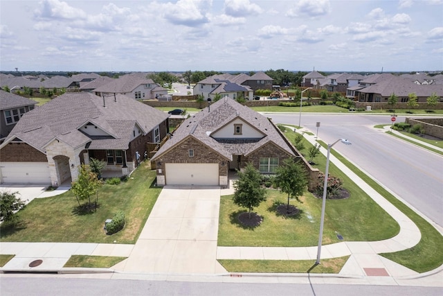 view of front of home featuring a front yard and a garage