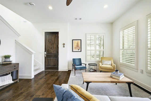 interior space featuring ceiling fan and dark wood-type flooring