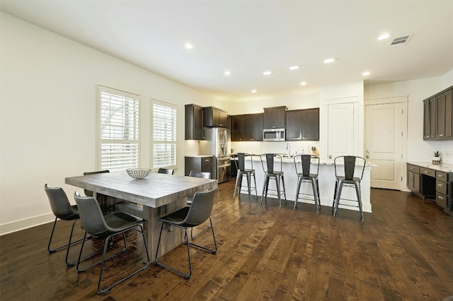 dining room with dark hardwood / wood-style floors