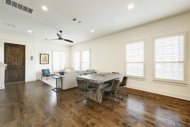 dining room featuring ceiling fan, dark hardwood / wood-style floors, and a wealth of natural light