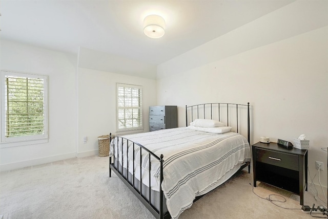 bedroom featuring light colored carpet