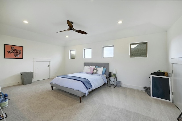 bedroom featuring light carpet and ceiling fan