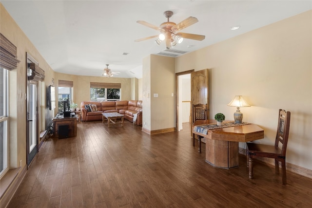 dining area with dark hardwood / wood-style floors and ceiling fan