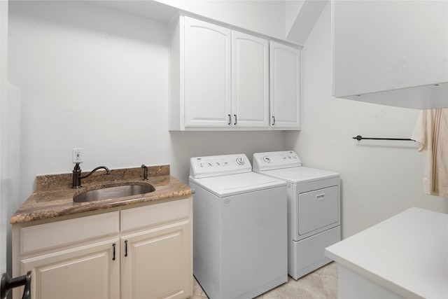 clothes washing area with cabinets, sink, separate washer and dryer, and light tile floors