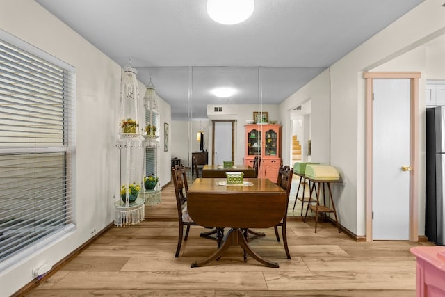 dining area with light wood-type flooring