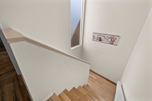 staircase featuring light hardwood / wood-style flooring