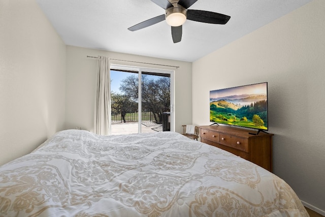 bedroom featuring ceiling fan and access to exterior