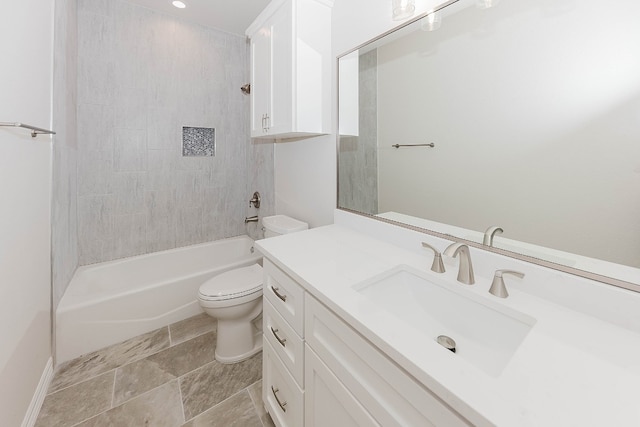 full bathroom featuring vanity, toilet, and tiled shower / bath combo