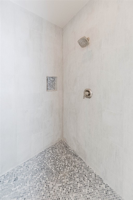 interior space featuring tiled shower