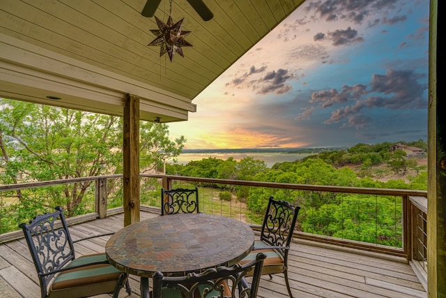 deck at dusk with ceiling fan