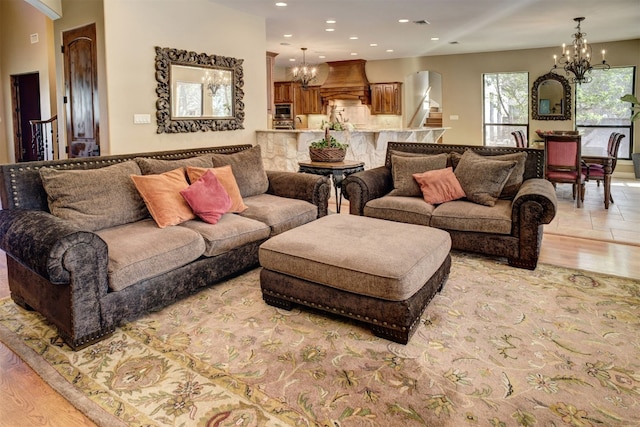 living room with light tile flooring and a chandelier