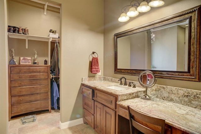 bathroom with tile flooring and vanity