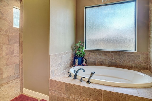 bathroom with tiled bath